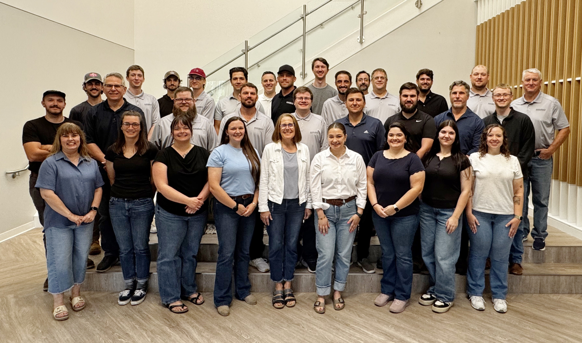 Employees all lined up for a company photo